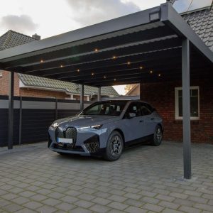 Carport with trapezoidal cover
