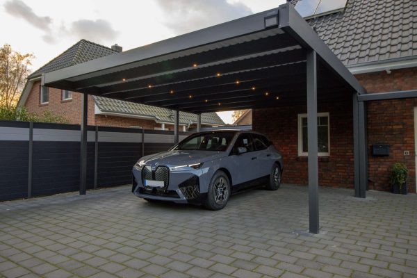 Carport with trapezoidal cover