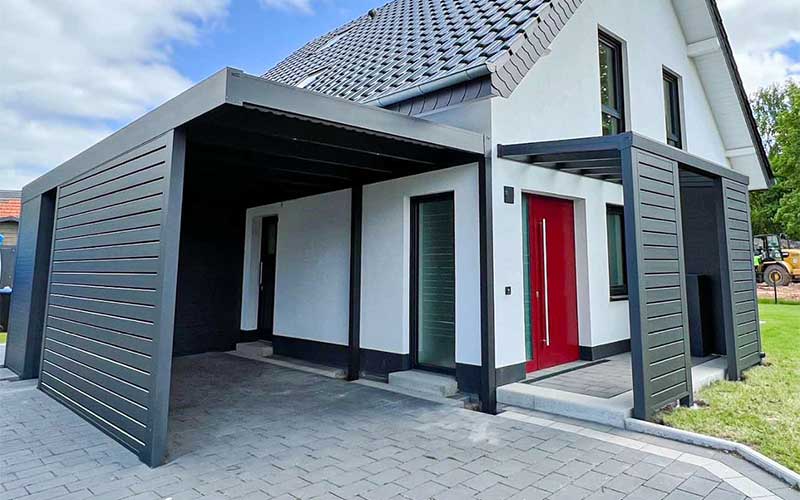 Carport with side walls attached to the house