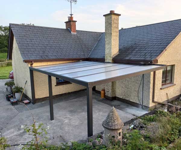 Wall-mounted canopy with polycarbonate roof in Co. Monaghan