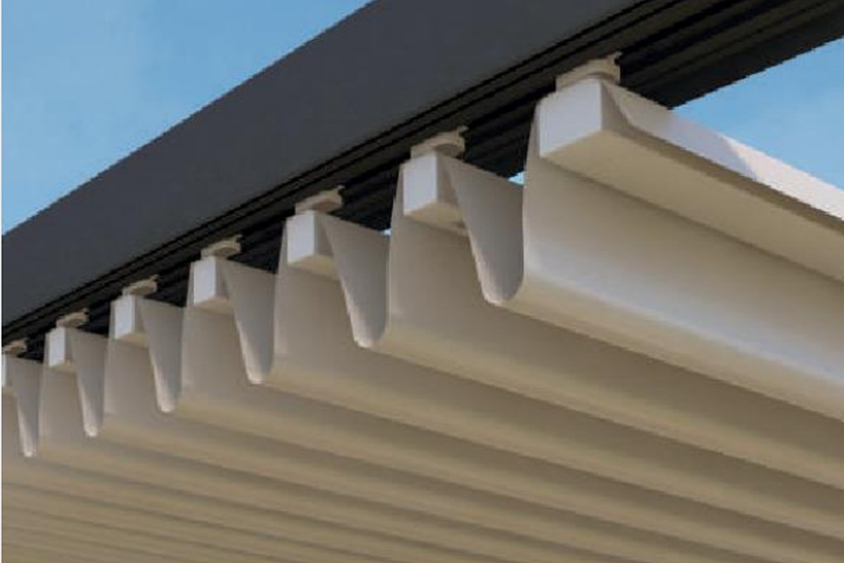 Folding fabric roof detail for retractable pergola