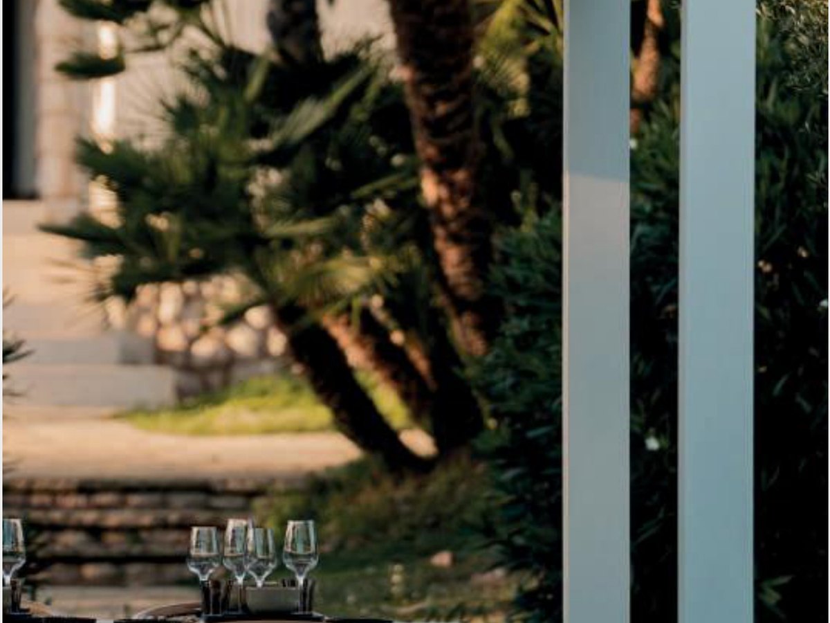 Luxury bioclimatic pergola dining area in garden