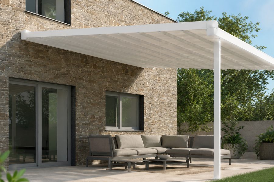 House with awning above patio seating area