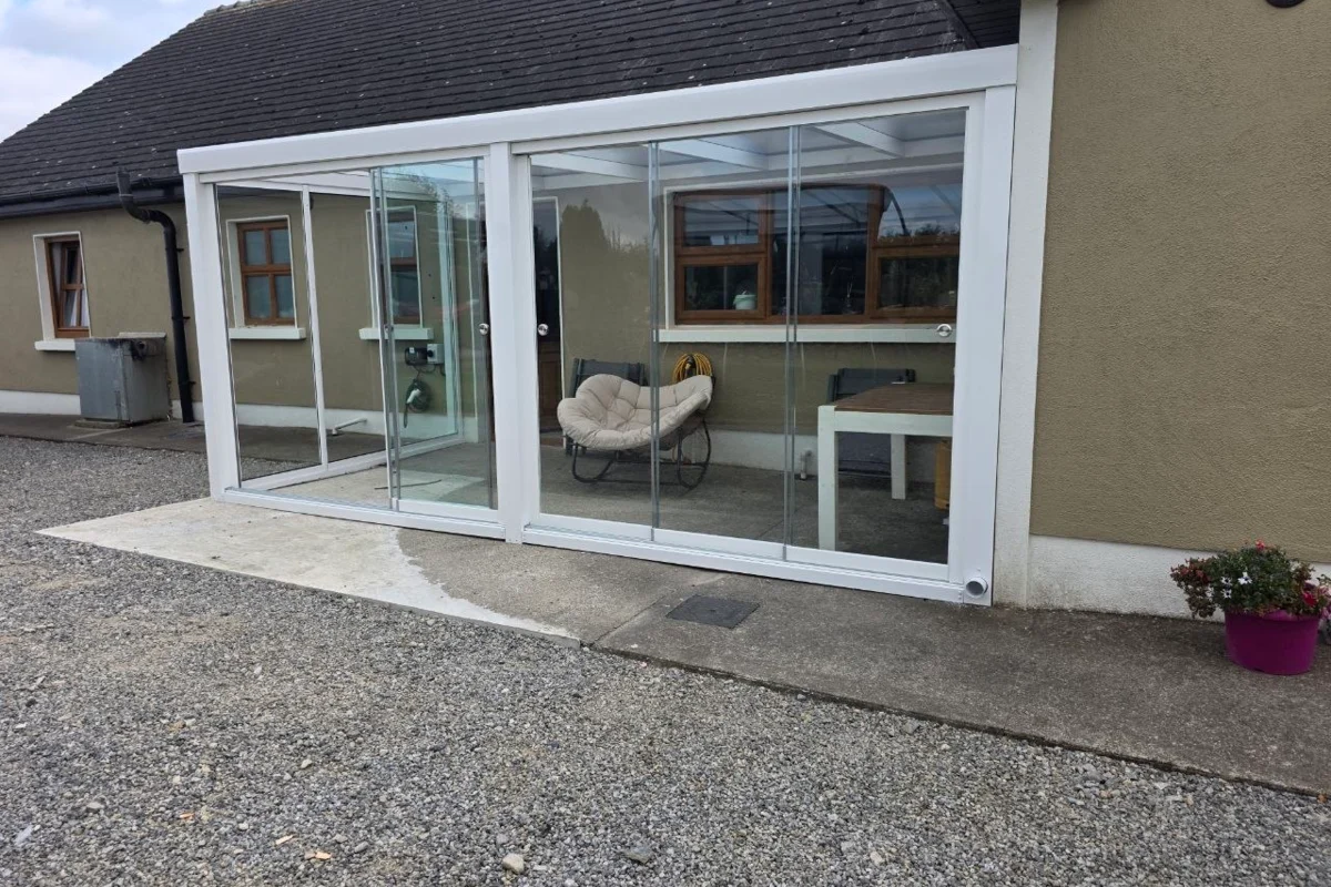 Fully enclosed aluminium garden room with sliding glass systems