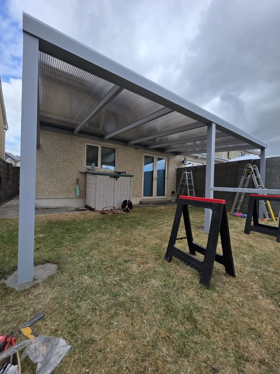 Clear polycarbonate roof panels during installation in Monasterevin