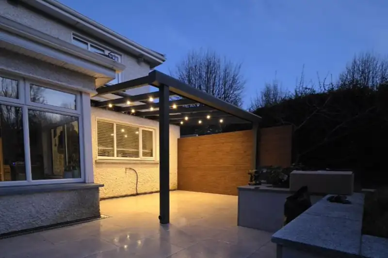 Residential wall-mounted aluminium pergola with integrated lighting