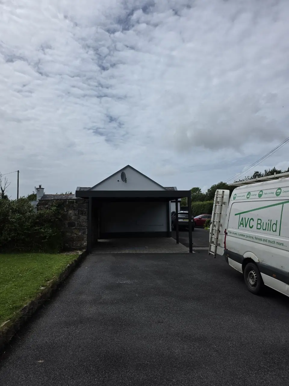 Driveway view of the completed two-car aluminium carport in Newport