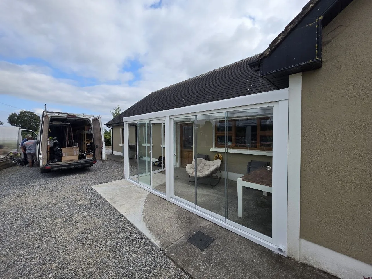 Side view of the completed white aluminium garden room in Roscommon