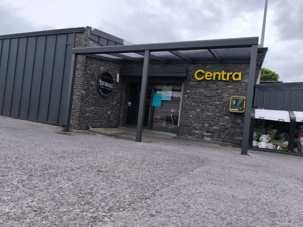 Wide view of the completed polycarbonate entrance canopy at the Centra premises
