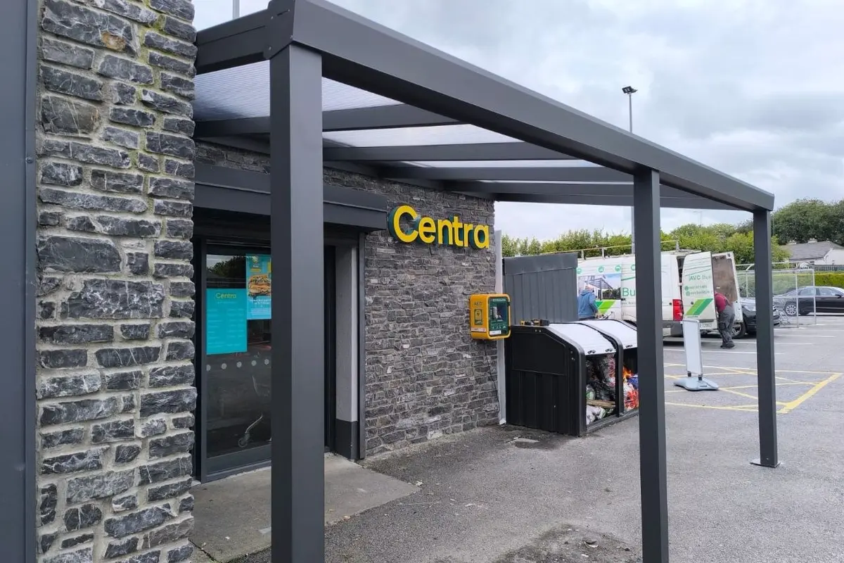 Black commercial polycarbonate entrance canopy installed at a Centra store in Roscommon