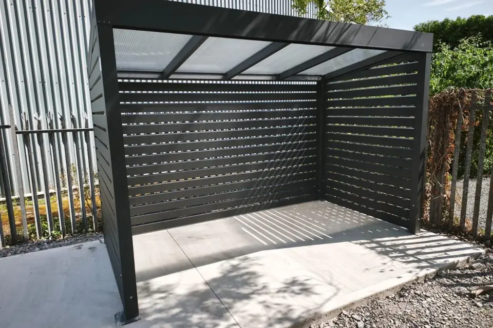 Black aluminium smoking shelter with a clear polycarbonate roof completed for Würth in Limerick