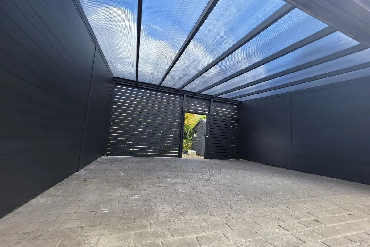 Interior of the enclosed aluminium carport garage with polycarbonate roof in Monkstown, Dublin