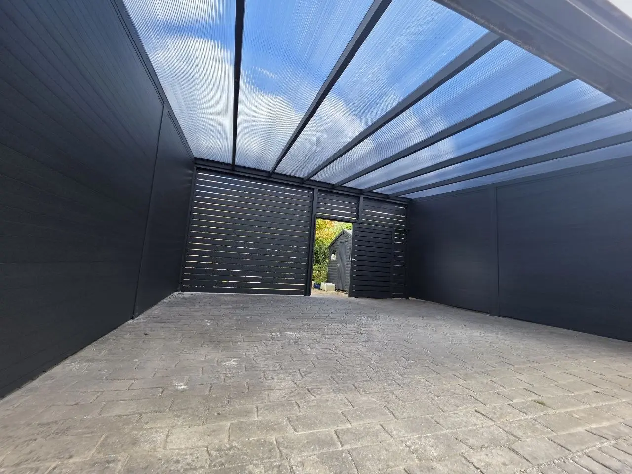 Wide interior view of the multiwall polycarbonate roof inside the Monkstown carport garage