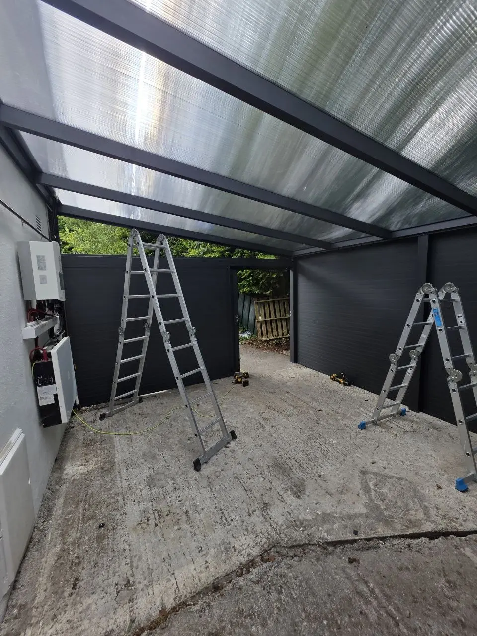 Interior of the enclosed aluminium carport and storage area in Kilbride