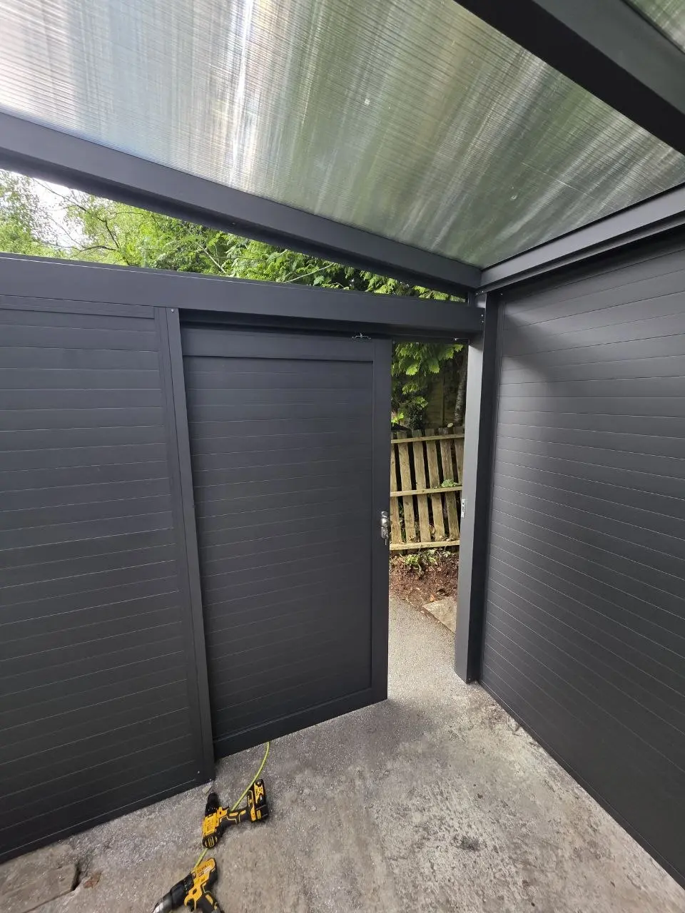 Interior detail of the pedestrian access door in the enclosed Kilbride carport