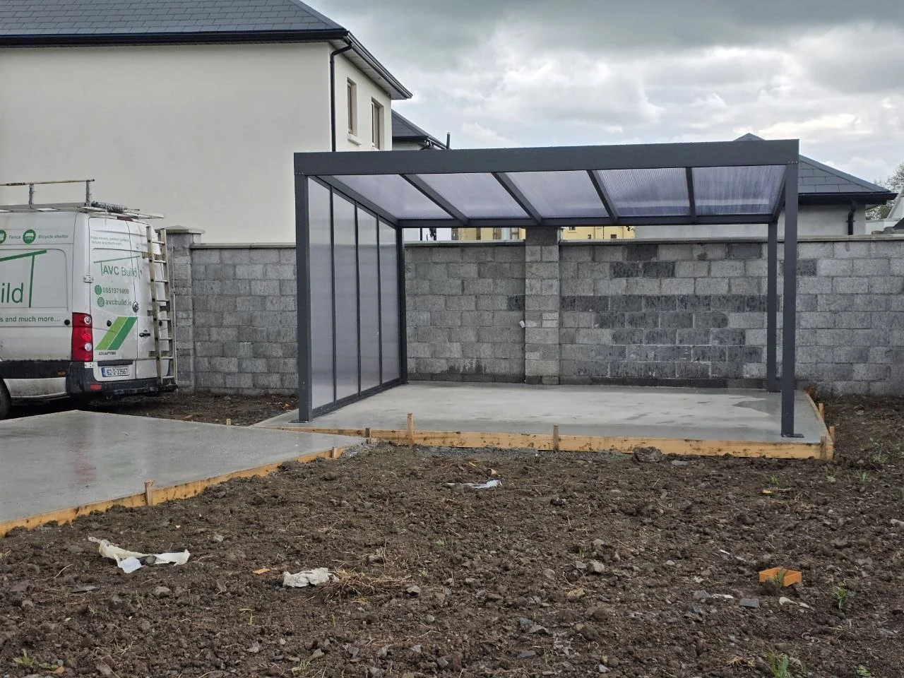 Completed freestanding aluminium pergola with opal polycarbonate roof and side wall in Roscommon
