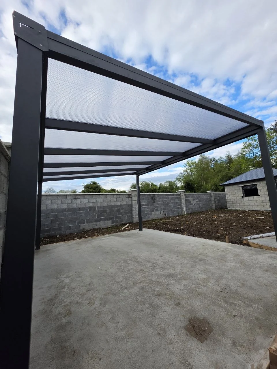 View beneath the opal polycarbonate roof of the freestanding pergola in Roscommon