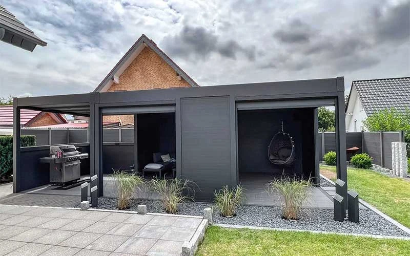 Freestanding aluminium garden room with trapezoidal roof and side walls
