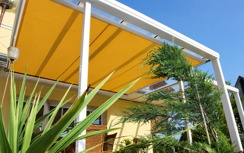 Fabric shade system installed within an aluminium outdoor structure