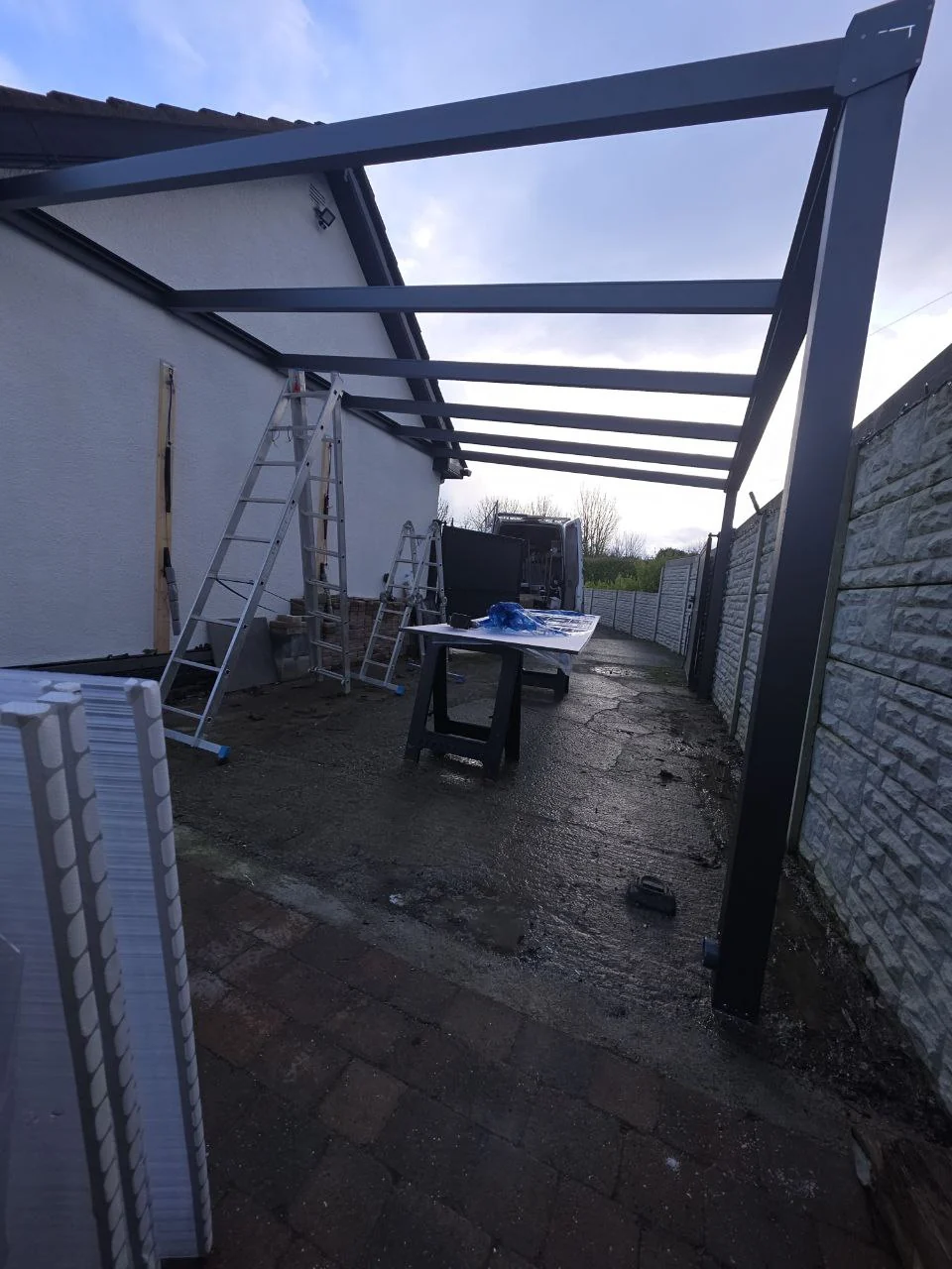 Side view of the aluminium carport frame during installation in Dublin