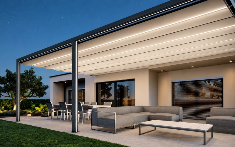 Illuminated patio awning creating adjustable shade above a residential terrace