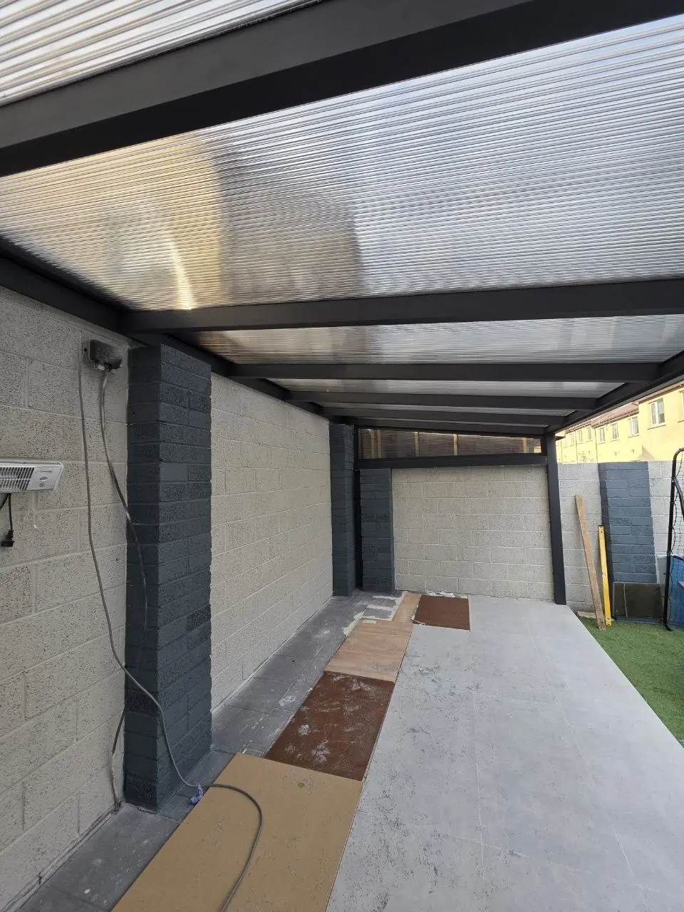 Interior view beneath the transparent multiwall polycarbonate roof of the Limerick patio canopy