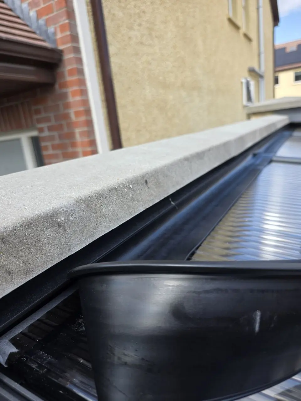 Wall connection and integrated drainage detail on the aluminium patio canopy in Limerick