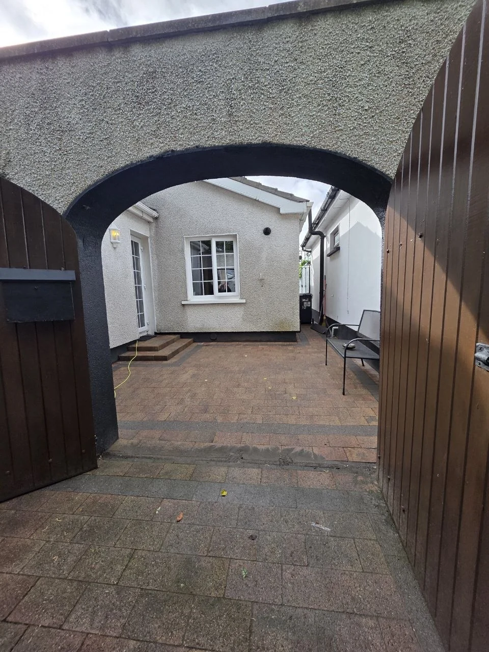 Angled view of the completed wall-mounted polycarbonate courtyard canopy in Dublin