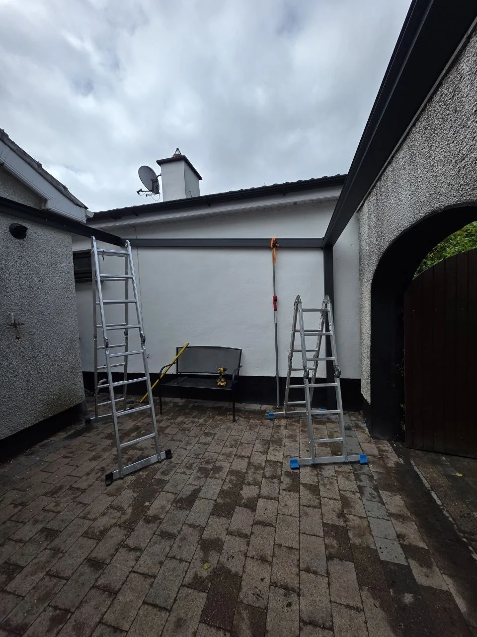 Anthracite aluminium courtyard canopy frame during installation at the Dublin home