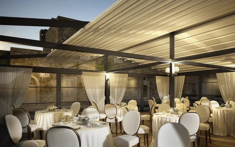 Retractable patio awning covering a hospitality terrace