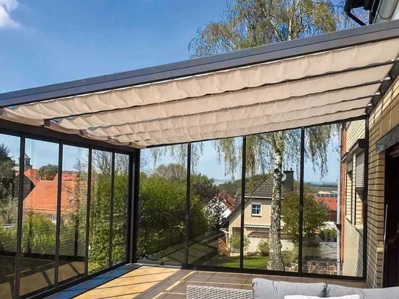 Sun sail shading installed beneath a transparent glass roof