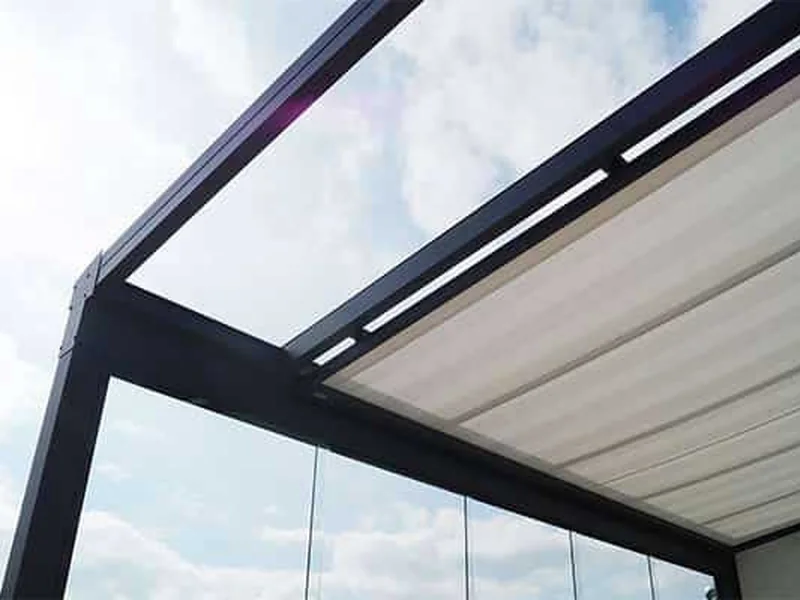 Under-roof awning installed beneath a transparent patio roof