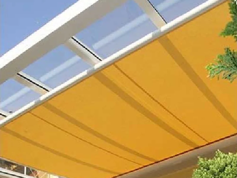 Under-roof awning installed beneath a transparent roof structure