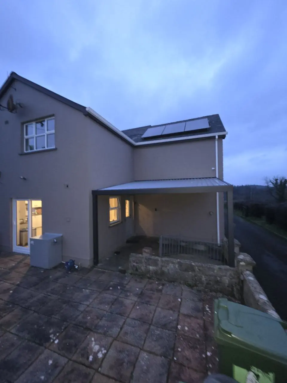 Wide view of the completed wall-mounted canopy at a Cavan home
