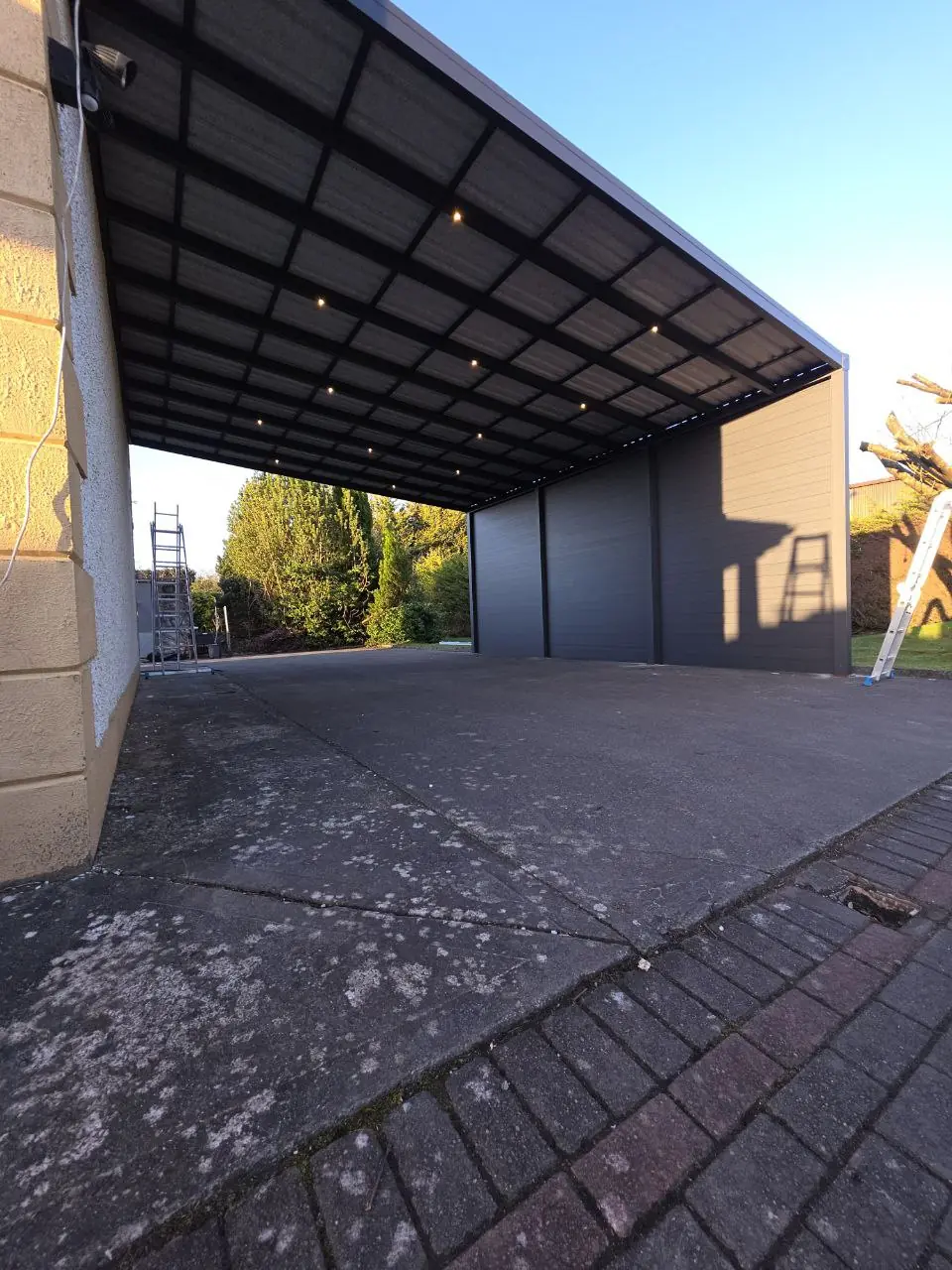 Integrated LED lighting beneath the completed aluminium carport roof