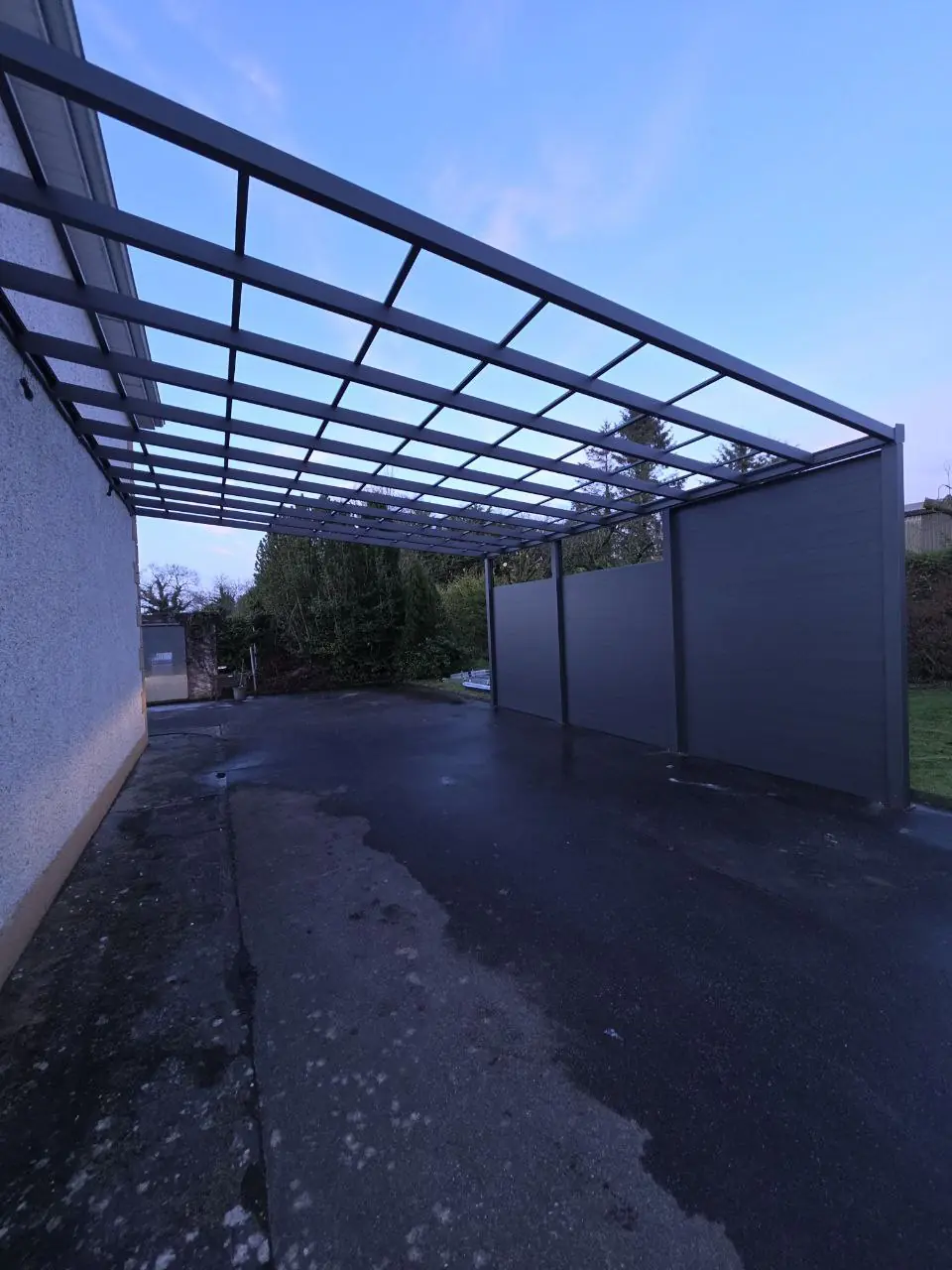Aluminium side panels being installed on the Cavan carport