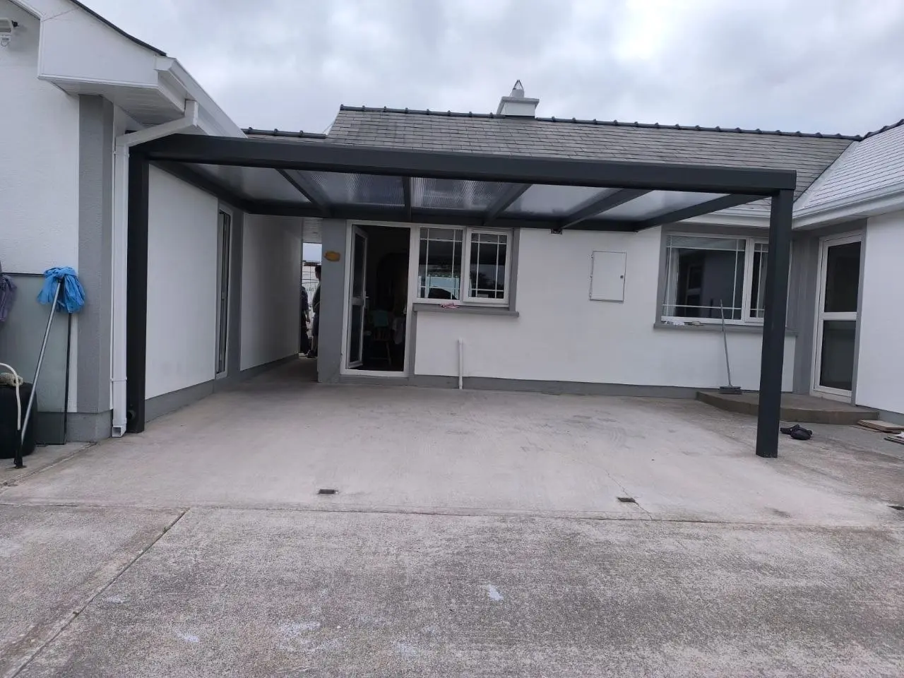 Front view of the completed wall-mounted patio canopy in County Leitrim