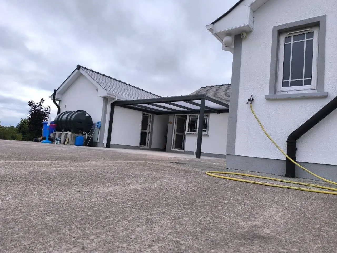 Wide property view showing the aluminium canopy covering the rear outdoor area in County Leitrim