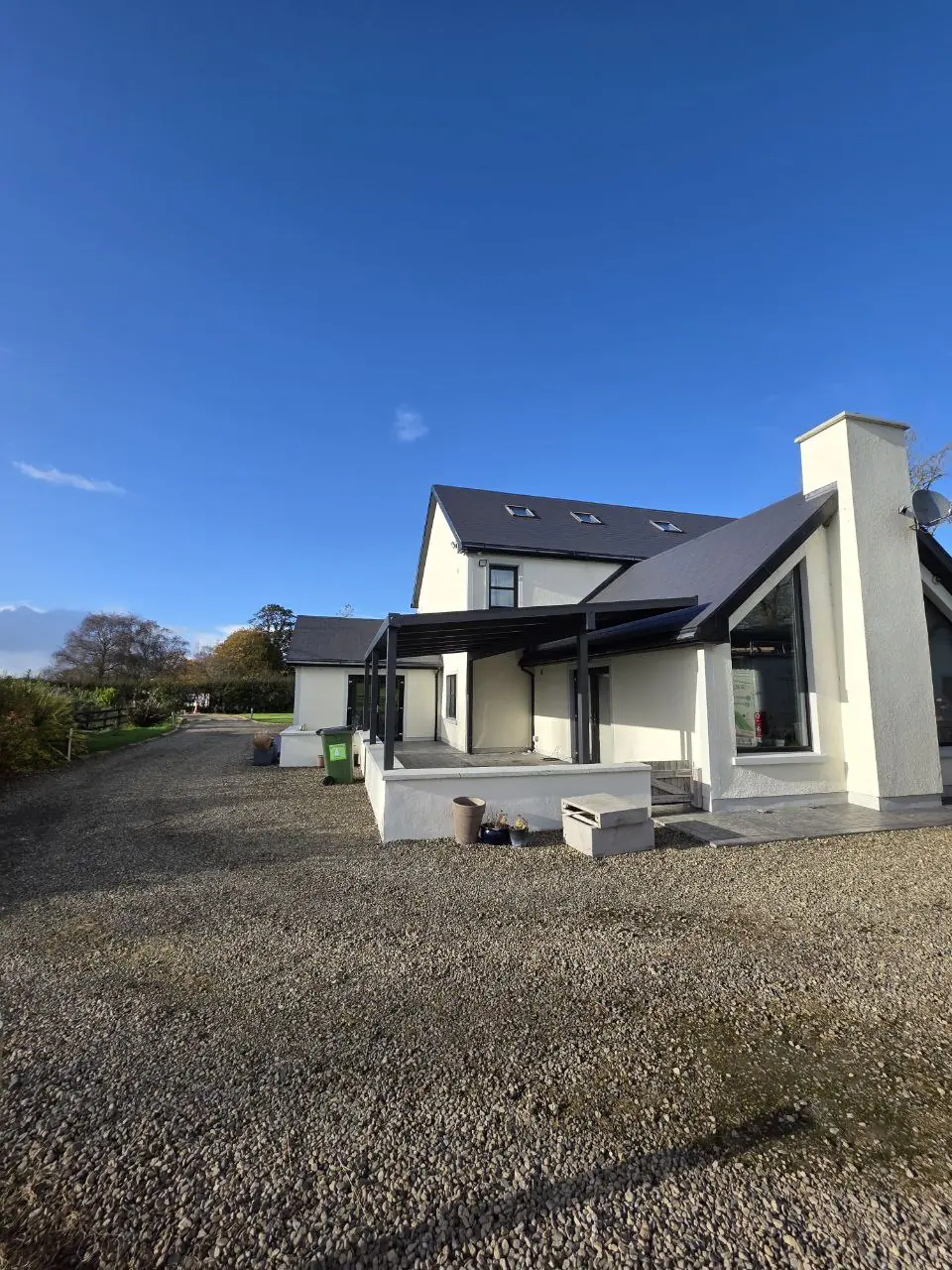 Side view of the completed aluminium pergola covering the raised terrace in Sixmilebridge