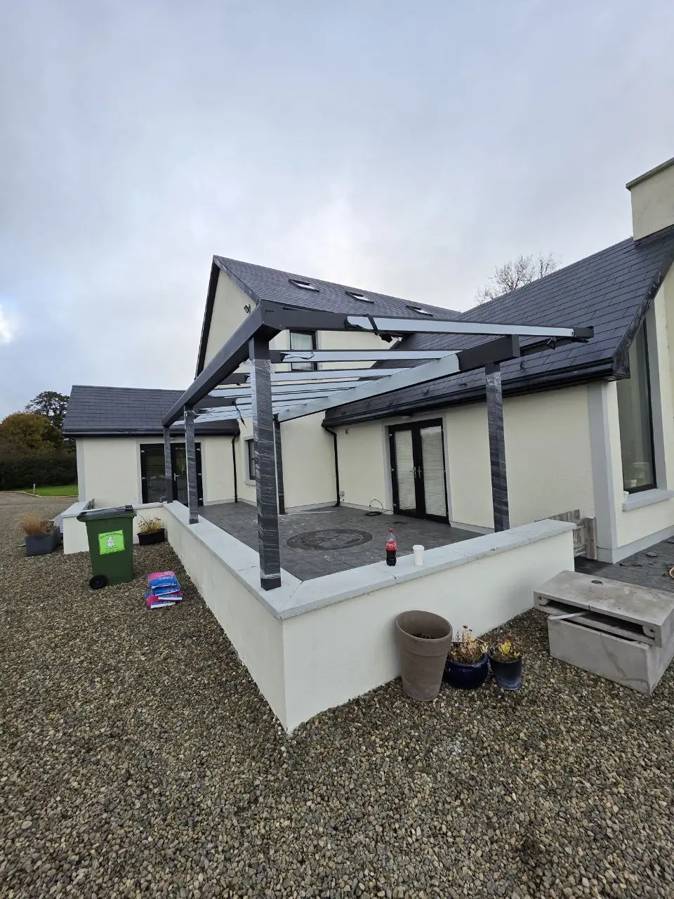 Angled view of the aluminium pergola roof frame during installation