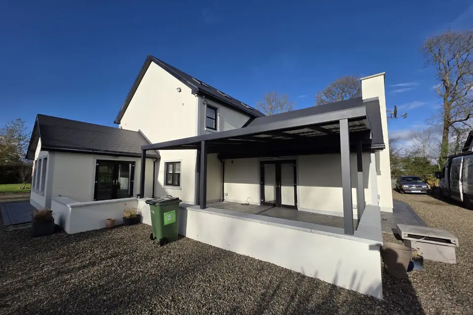 Wall-mounted aluminium pergola with LED lighting completed in Sixmilebridge, County Clare