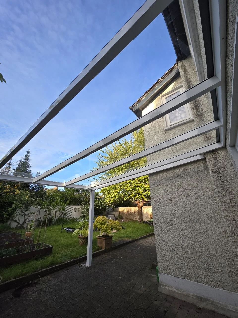 View from beneath the fixed glass roof beside the rear entrance in Dublin