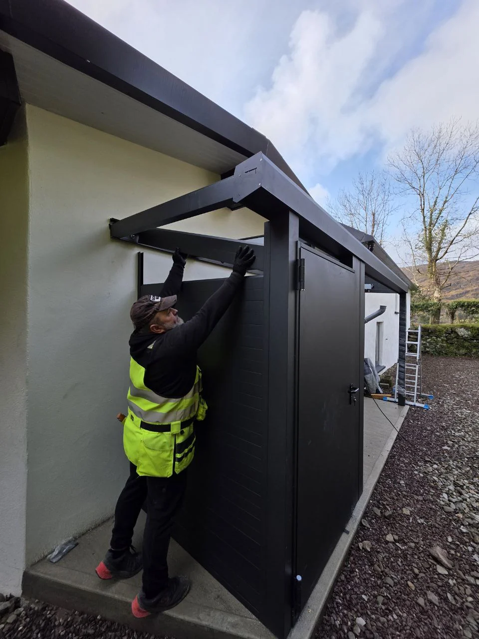 Installation of the aluminium storage room and entrance canopy at a residential property in Cork