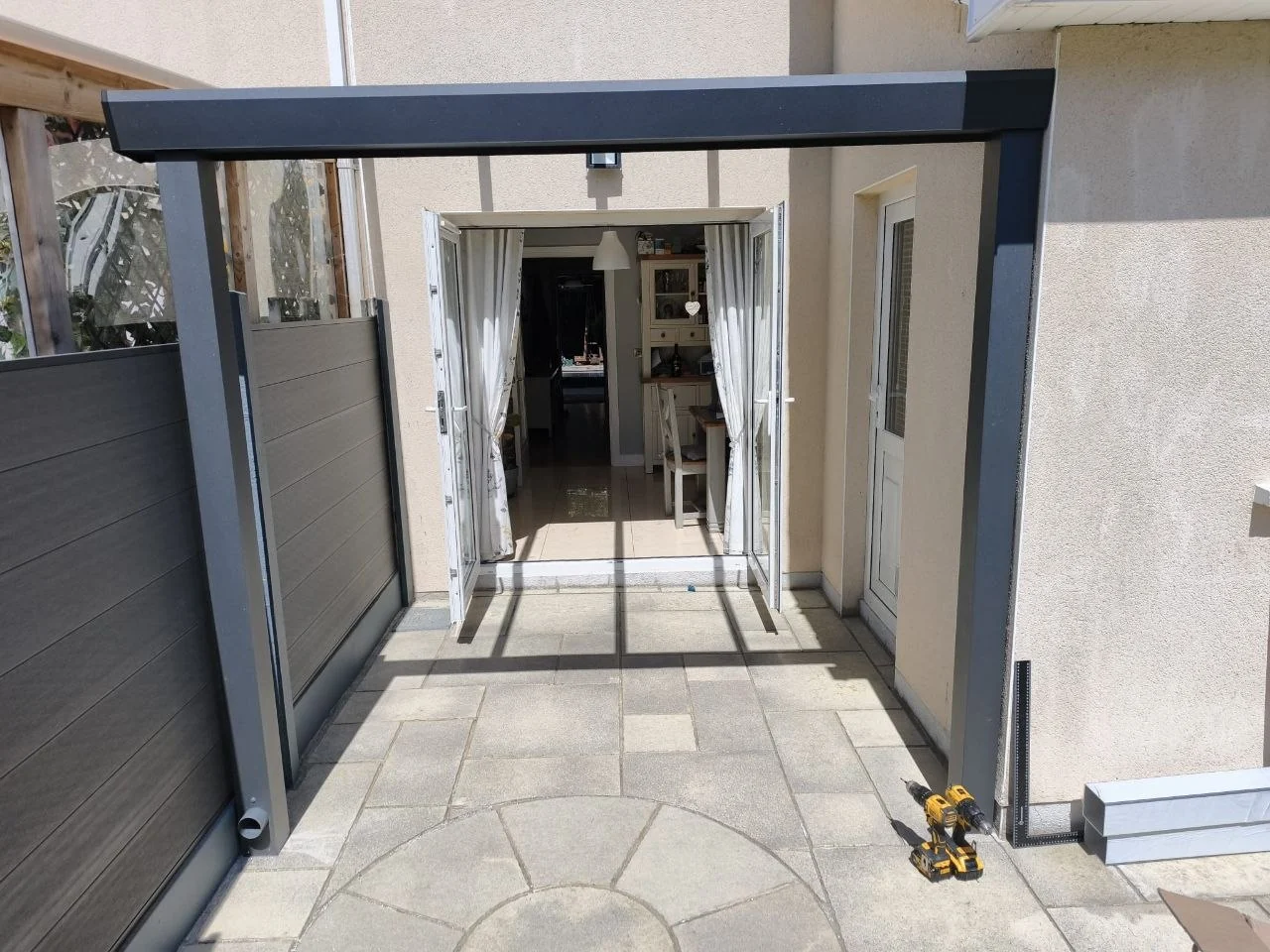 Front view of the completed aluminium entrance canopy with fixed glass roof in Dublin