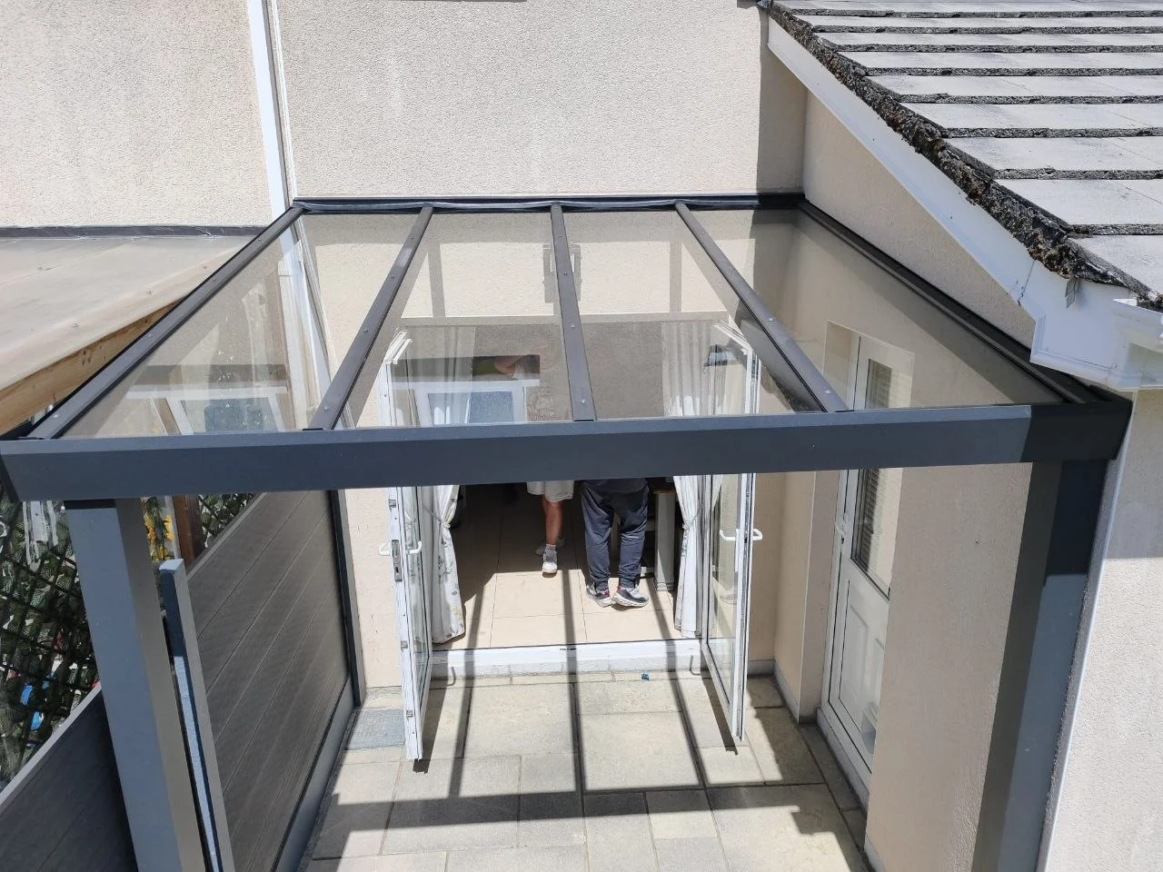 Fixed glass roof detail on the black aluminium entrance canopy in Dublin