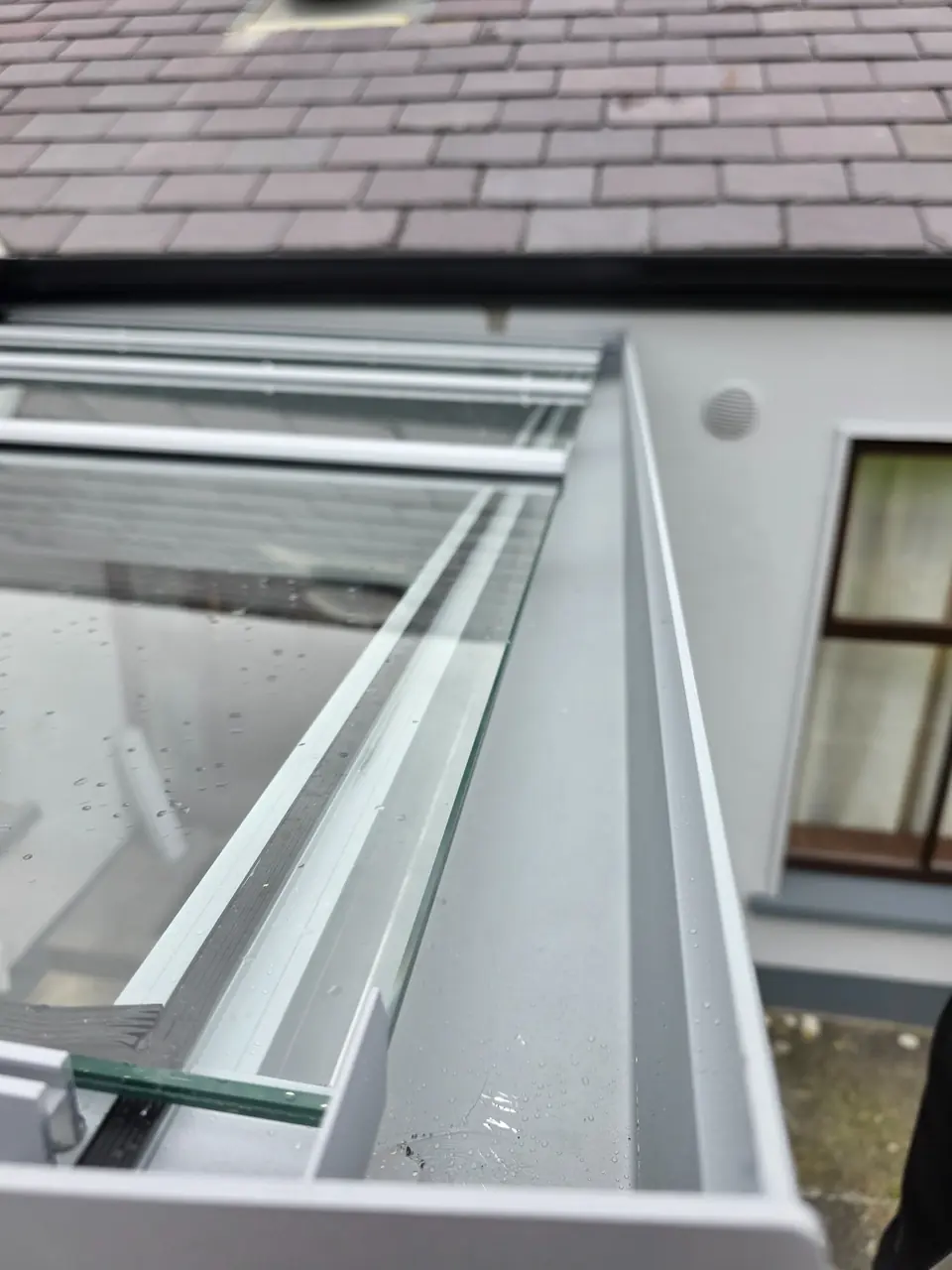 Close view of the polycarbonate canopy roof and integrated drainage channel