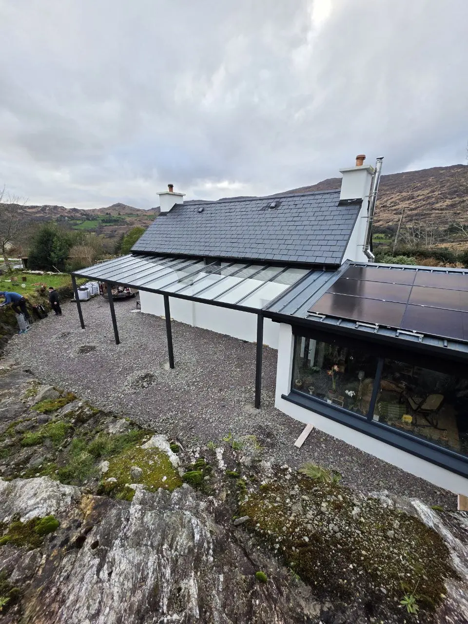 Elevated view of the completed wall-mounted glass pergola in Bantry