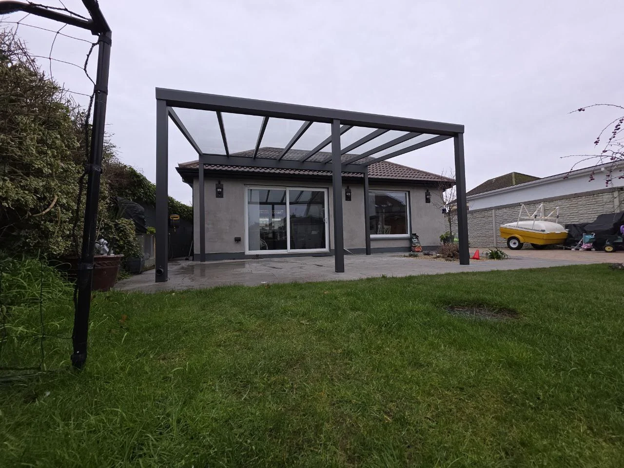 Front view of the completed freestanding glass pergola in Dublin