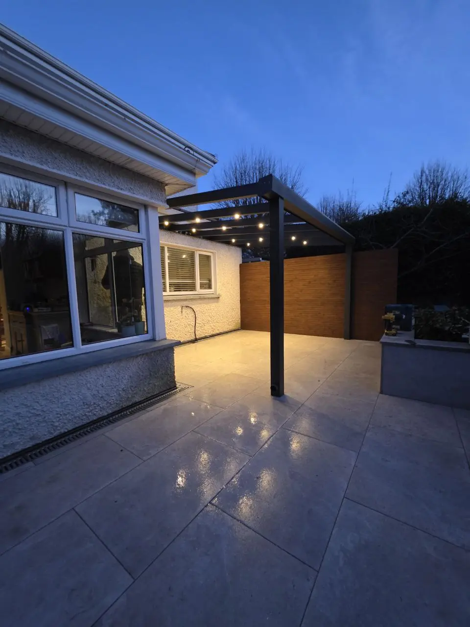 Integrated LED lighting beneath the completed polycarbonate pergola in Greystones