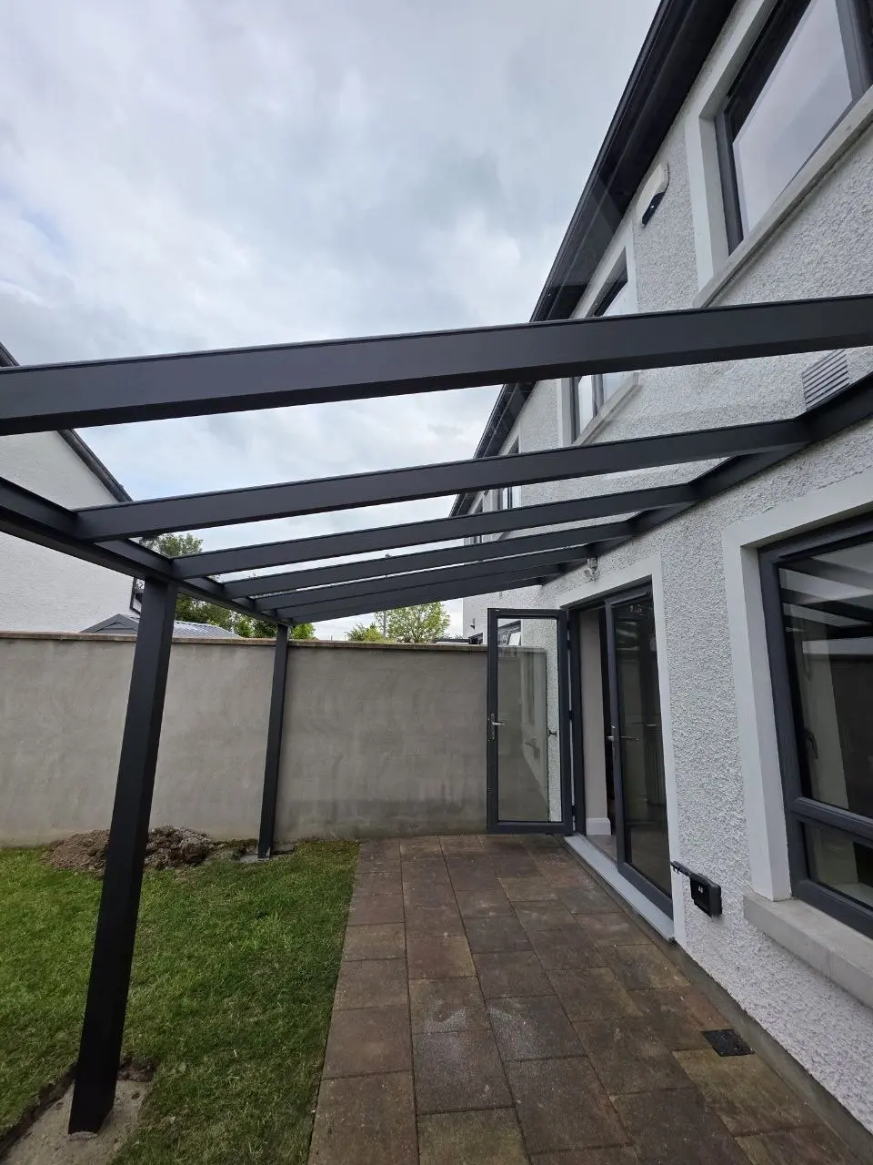 Interior view of the black aluminium roof frame during installation